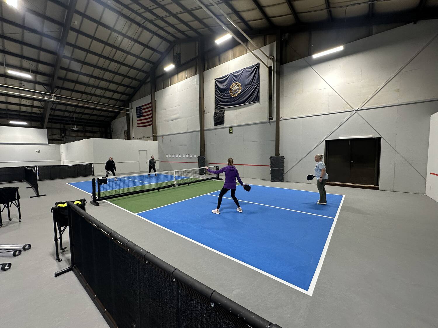 Players in a rally on the indoor courts at WMPC