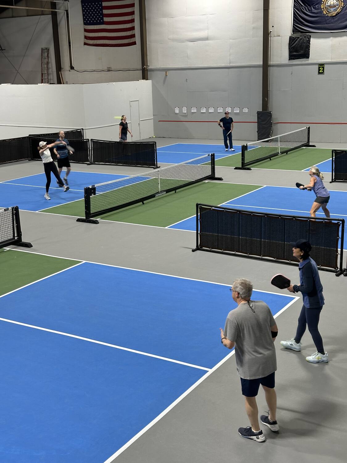 Members playing on the indoor courts at WMPC