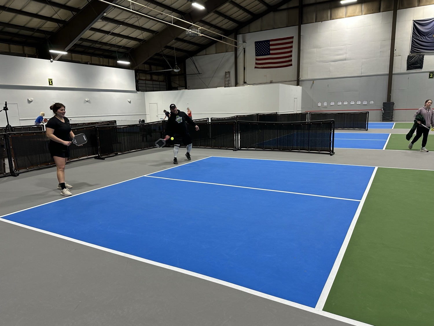 A player on the indoor courts at White Mountain Pickleball Club