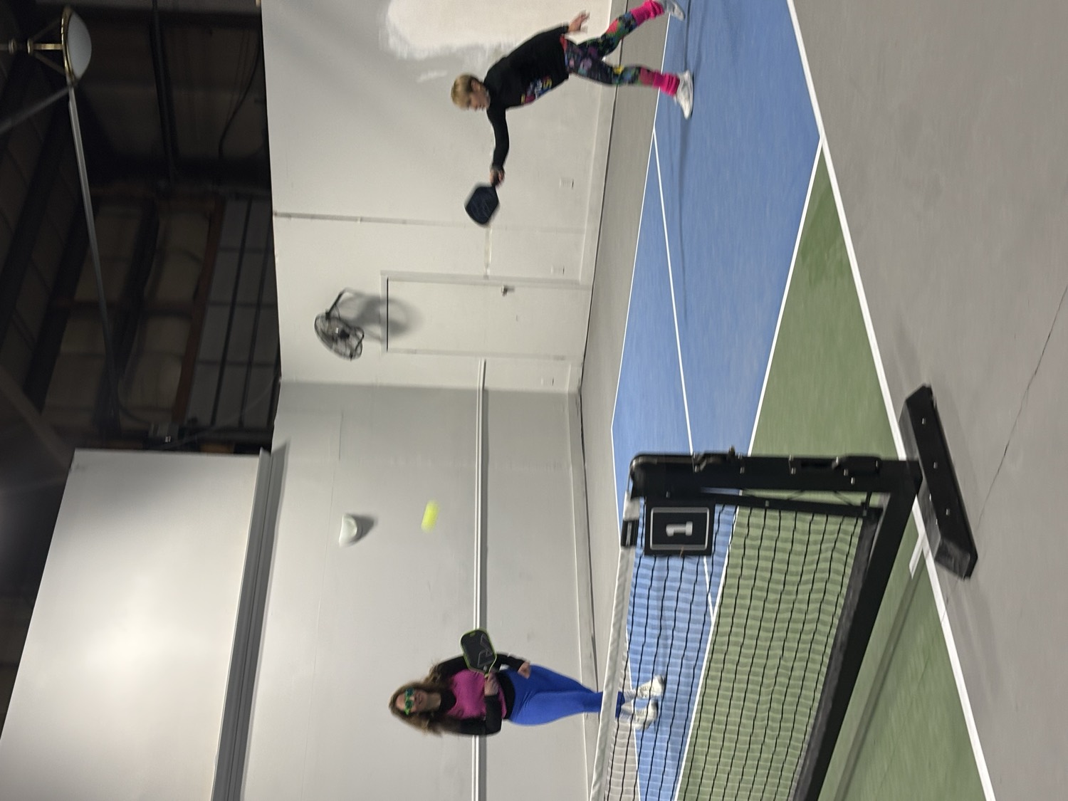 Players in a rally on the indoor courts at WMPC